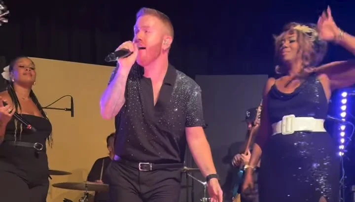 Lost Wax vocalists singing together on stage at the Nebraska Wedding Day Best of 2026 Awards Gala at The Leo Ballroom in Omaha, NE on June 16, 2026