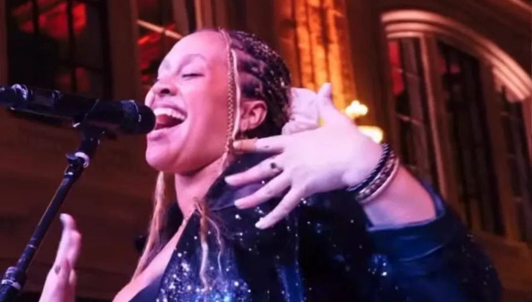 Lost Wax vocalist singing beneath the arched windows at the Render + Turner wedding at Union Station Kansas City, Kansas City, MO in 2026